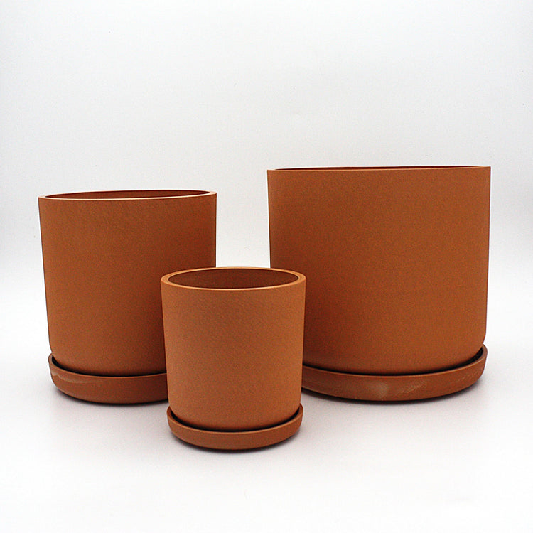 Coordinated Portland large set of three statement recycled plastic plant pots with matching saucers on a clean white background, available in Australia. Dusted Clay shown.