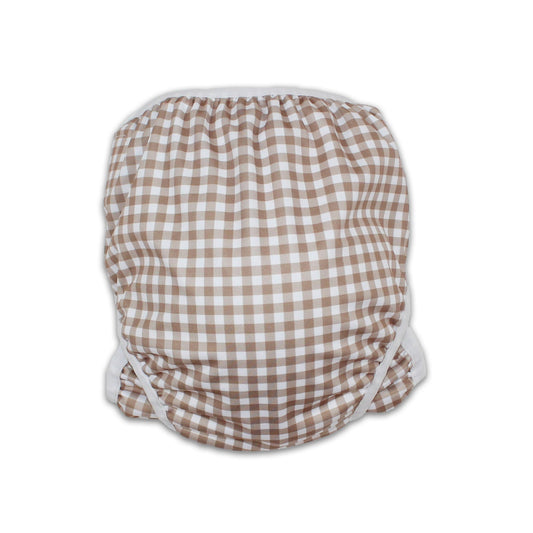 As seen on Chemist Warehouse. Tyoub Reusable and Adjustable Swim Nappy. The Reusable Swim Nappy and Wet Bag in the colour black and white Gingham Check is Excellent for swimming lessons and all aquatic play. This swim nappy fits all babies from 3 months to 3 years old. With double inner leg gusset, it is leak and accident proof. Has a Snug fit and soft elastic seams. With no gaps, the exact waistband fit with soft VELCRO tabs. Made in quick dry fabric.