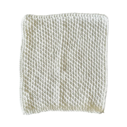 White handmade knitted dishcloth made from absorbent recycled cotton for kitchen and bathroom use.