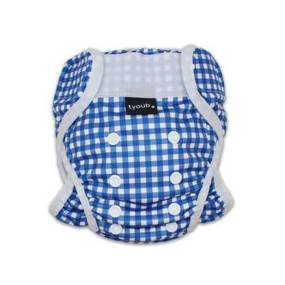 Close-up of an adjustable reusable baby swim nappy with snap buttons in a blue gingham check pattern.