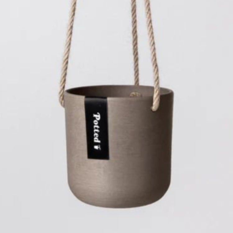 Single Austin recycled plastic hanging planter pot with fine woven hemp rope and metal S hook on a clean white background in small beachwood showing the potted label.