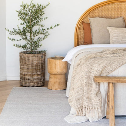 Zebra Home Bates ivory large area rug styled in a modern coastal bedroom under a timber bed frame, perfect for Australian homes.