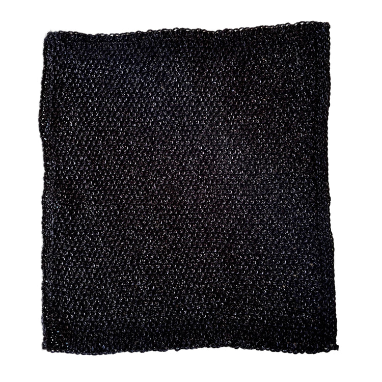 Black handmade heavy-duty acrylic scrubbing cloth made from salvaged yarn mill ends for tough kitchen cleaning.