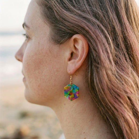 On-model style photo showcasing the fit, drop length, and geometric scale of the upcycled blue multi hexagon dangle earrings in Australia.