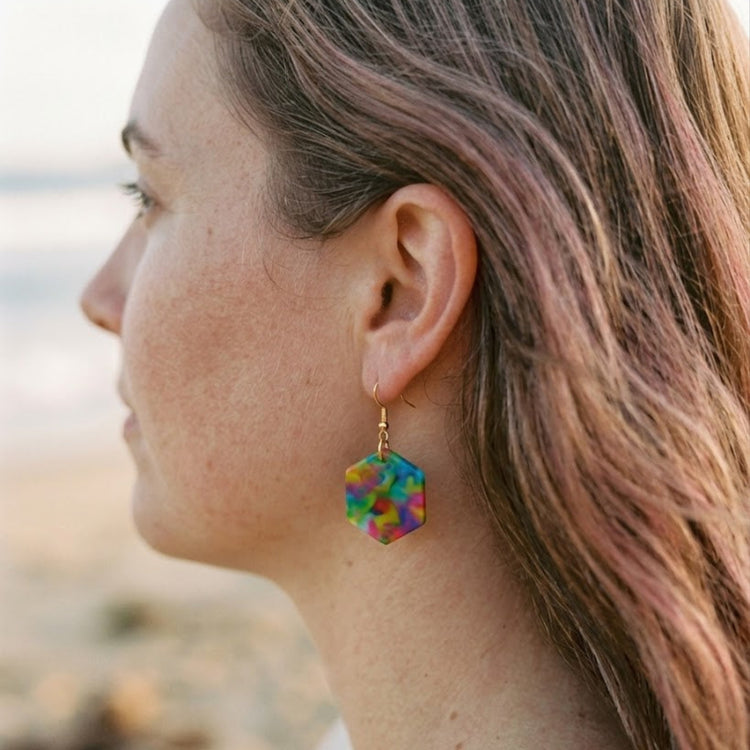 On-model style photo showcasing the fit, drop length, and geometric scale of the upcycled blue multi hexagon dangle earrings in Australia.