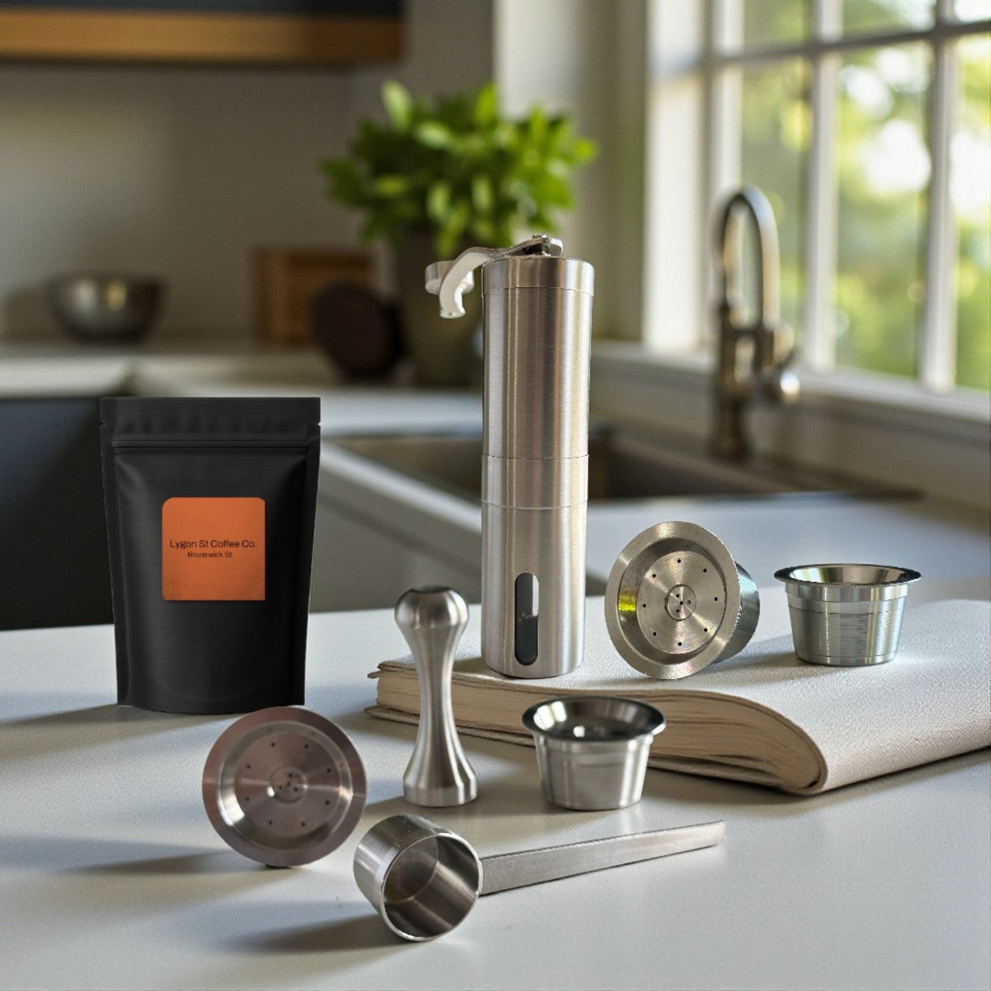 Rich espresso crema pouring into a glass cup from a sustainable Pod Star stainless steel refillable pod inside a compatible kitchen capsule machine.