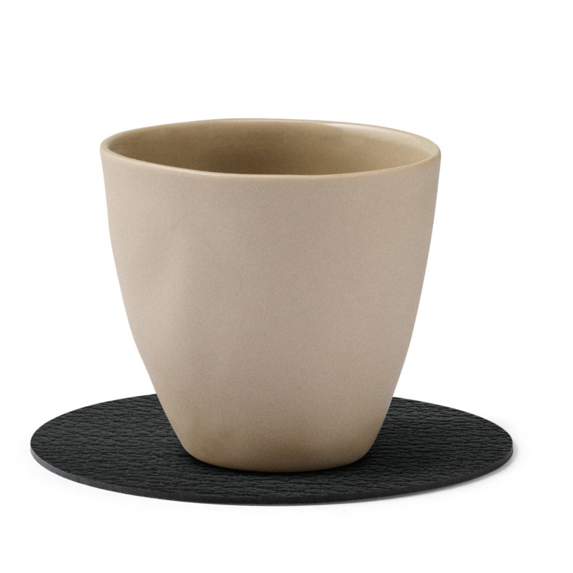 Circle recycled leather coaster featuring the signature LIND DNA buffalo texture with a ceramic cup.