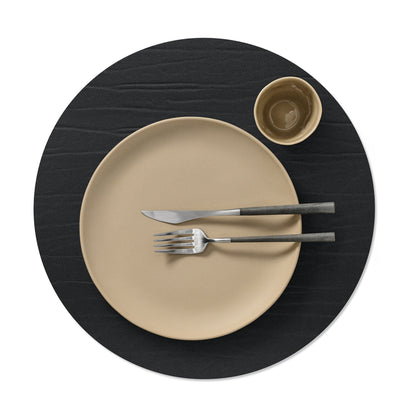 Circle recycled leather placemat featuring the signature LIND DNA Buffalo texturewith plate setting and cup in black.