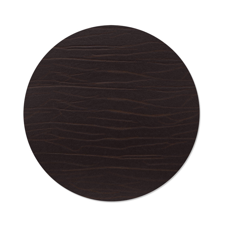 Circle recycled leather placemat featuring the signature LIND DNA Buffalo texture.