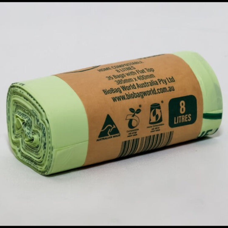 Close up of Compost Mate 8 litre bio-plastic liner roll highlighting official AS5810 home compostable and AS4736 commercial compostable certifications.