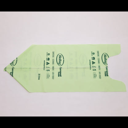 Close up of Compost Mate bio-plastic liner roll highlighting official AS5810 home compostable and AS4736 commercial compostable certifications 20 litre unrolled.