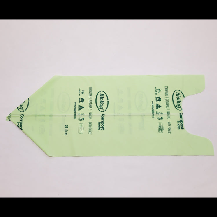 Close up of Compost Mate bio-plastic liner roll highlighting official AS5810 home compostable and AS4736 commercial compostable certifications 20 litre unrolled.