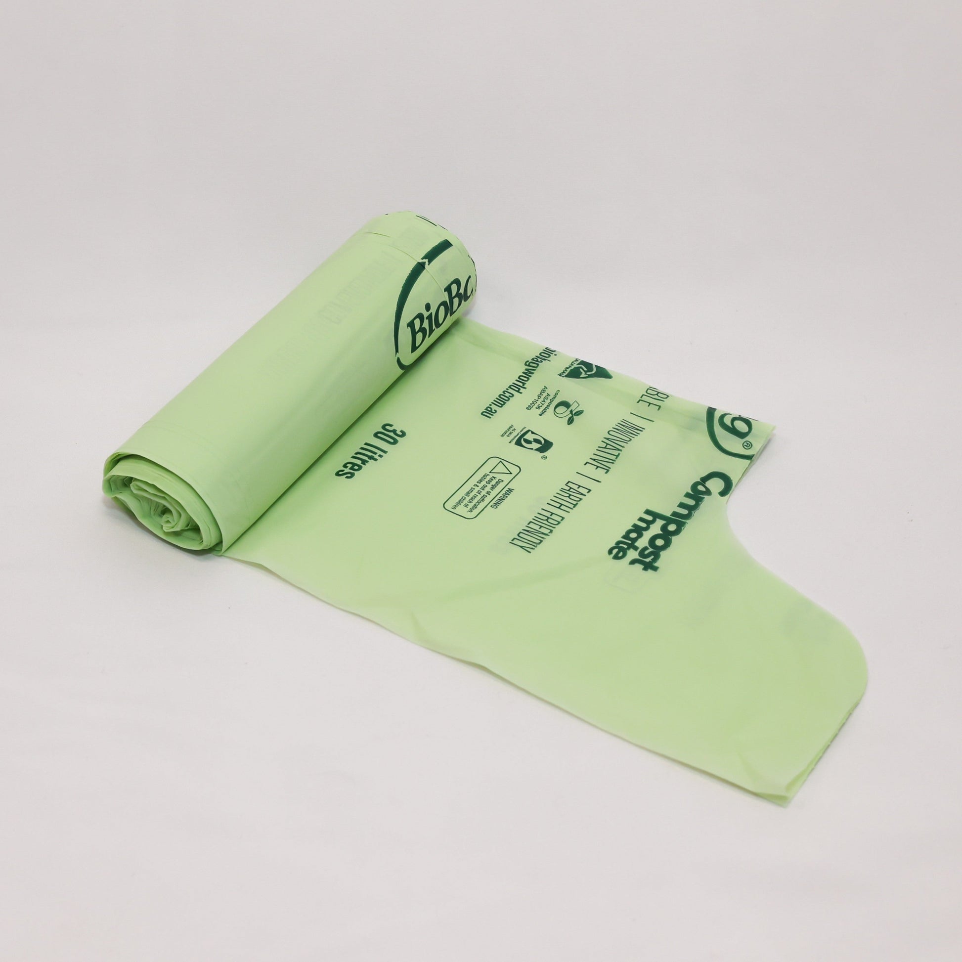 Close up of Compost Mate bio-plastic liner roll highlighting official AS5810 home compostable and AS4736 commercial compostable certifications.