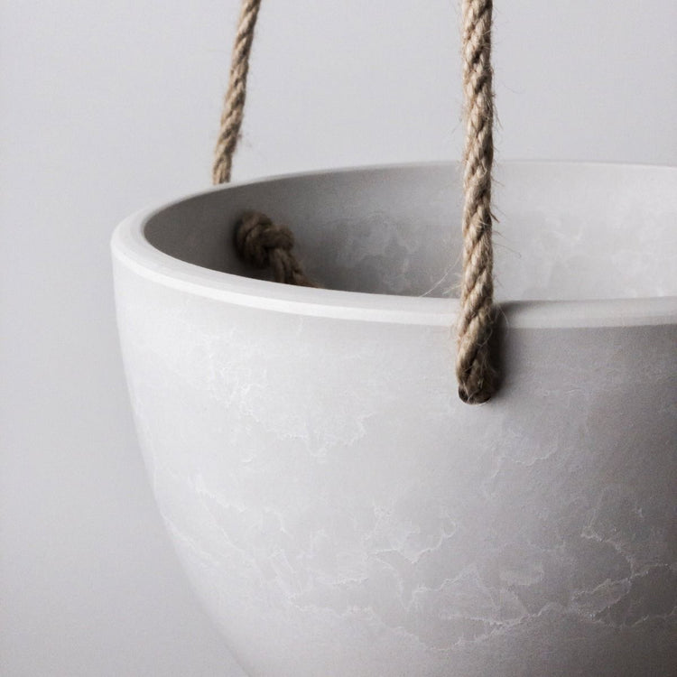 Single Columbia recycled plastic hanging planter bowl in white showing a close up of the hemp rope and stone like texture.