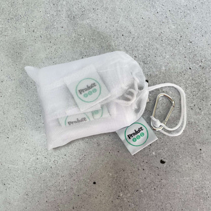Multi pack mesh produce sleeves placed directly inside a large Produce Pod storage bag, demonstrating seamless zero unpack fridge organisation.