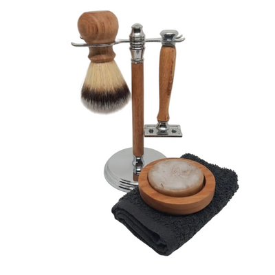 A premium 3-piece traditional men's grooming kit featuring a hand-turned recycled timber double-edge safety razor and matching shave brush on an organized wooden display stand, handcrafted in Australia in chrome.