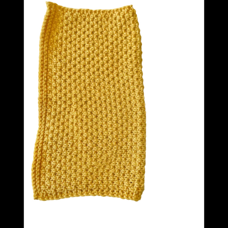 Daffodil handmade knitted dishcloth made from absorbent recycled cotton, folded in half, for kitchen and bathroom use on a white background.