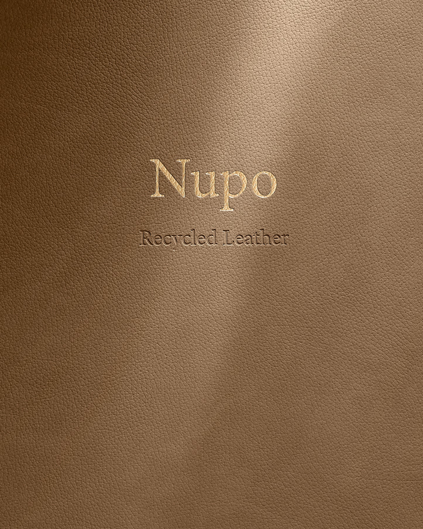 Brown leather surface with 'Nupo Recycled Leather' embossed text
