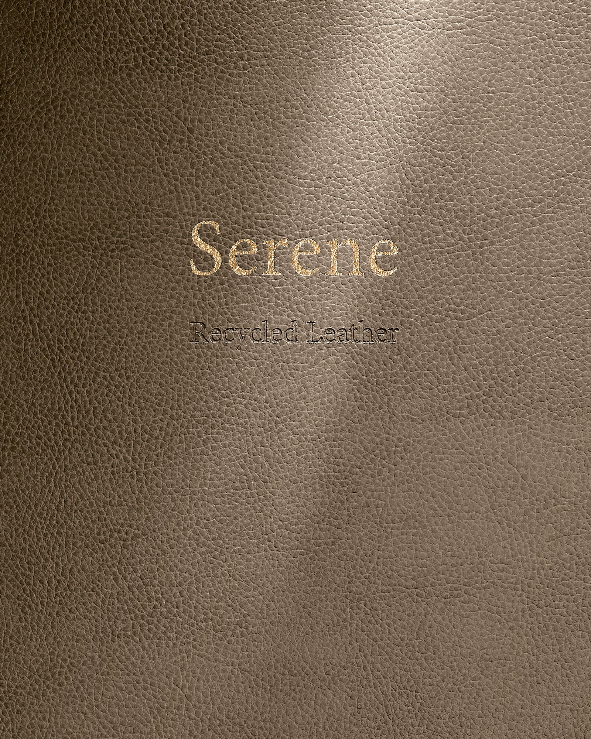 Brown leather surface with 'Serene' and 'Recycled Leather' text.