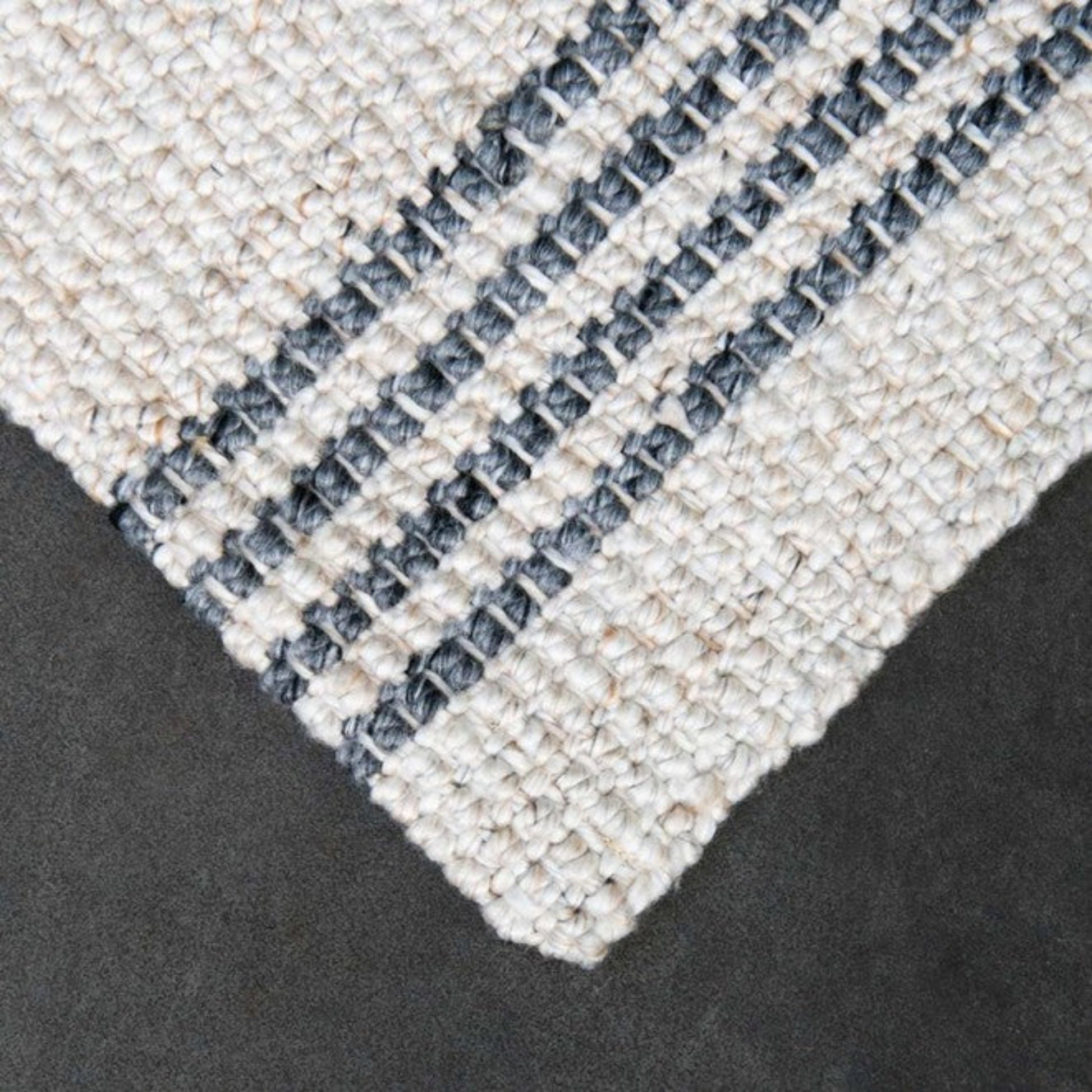 Detailed corner weave of the Zebra Home Macintosh eco-friendly and machine-washable kitchen or laundry floor mat.