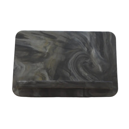 Fully assembled EcoView mobile phone stand made from marbled recycled plasticin Gathering storm front.