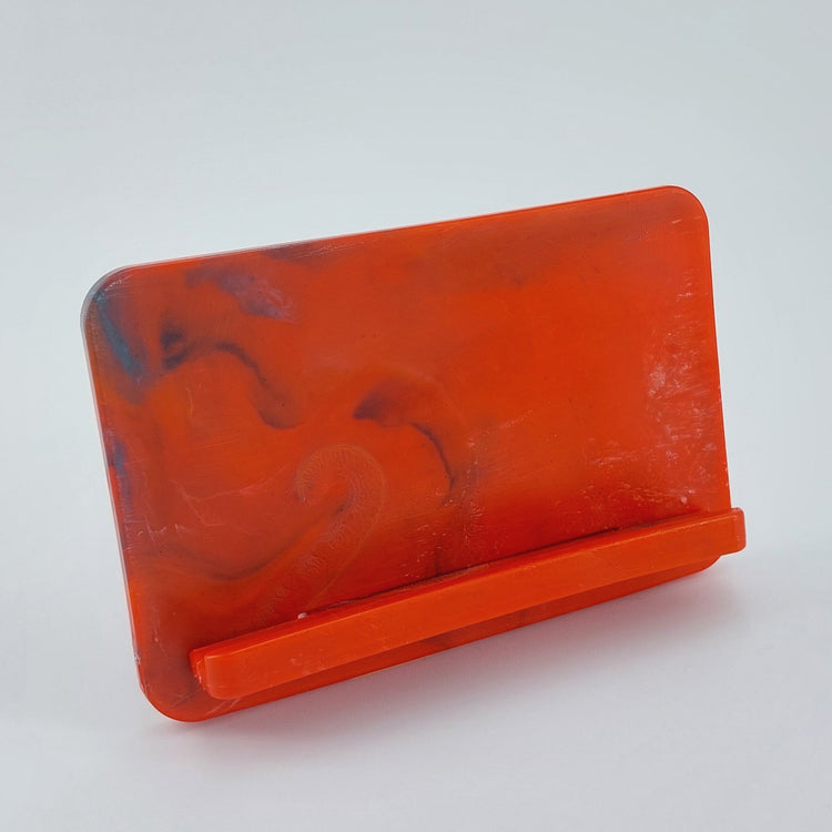 Fully assembled EcoView mobile phone stand made from marbled recycled plastic in Red. Eco friendly desktop phone holder in Australia.