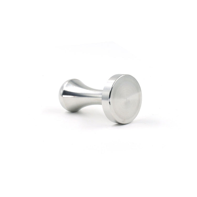 A close-up view of the Pod Star coffee pod tamper resting on its side for Caffitaly and Lavazza compatible capsule systems.