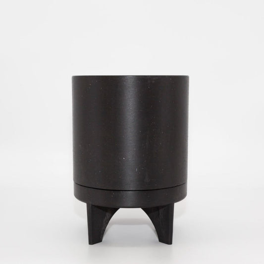 Single Florence recycled plastic plant pot with a smooth minimalist tapered silhouette on a clean white background, available in Australia. Black shown.