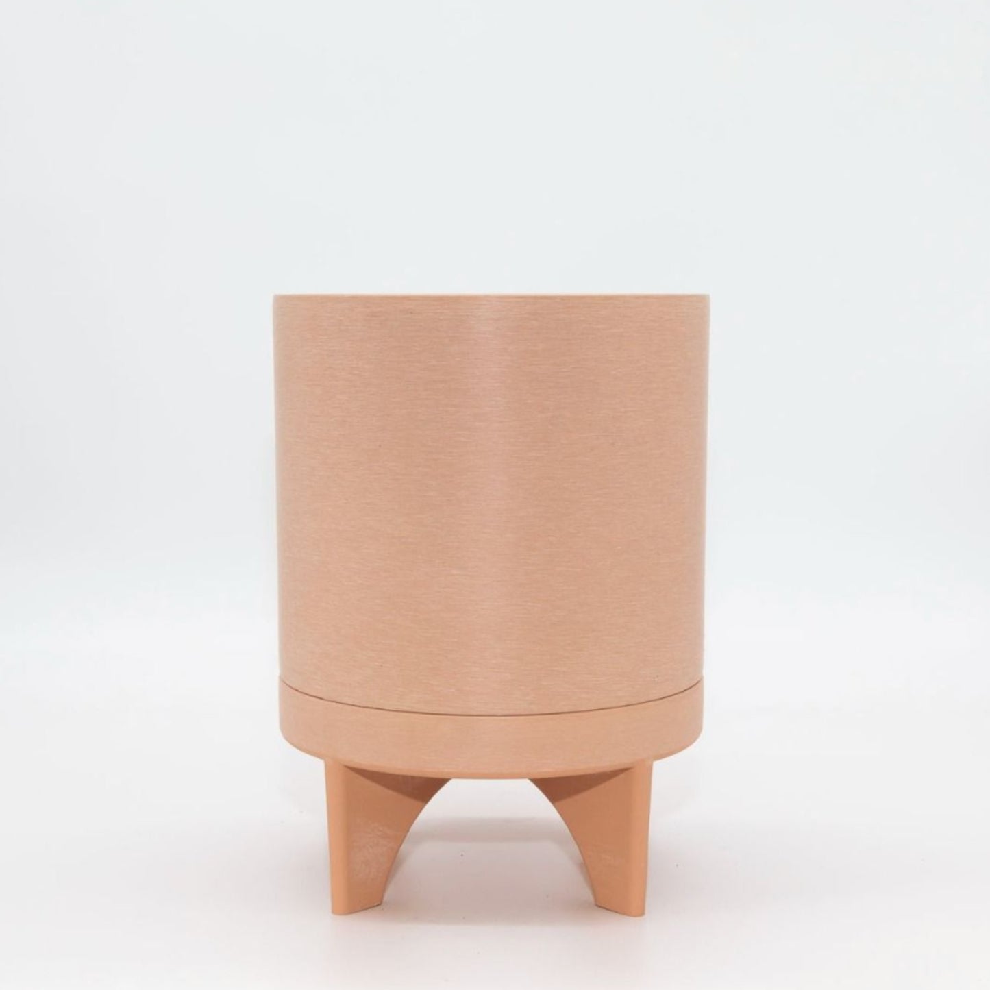 Single Florence recycled plastic plant pot with a smooth minimalist tapered silhouette on a clean white background, available in Australia. Muted coral variant.