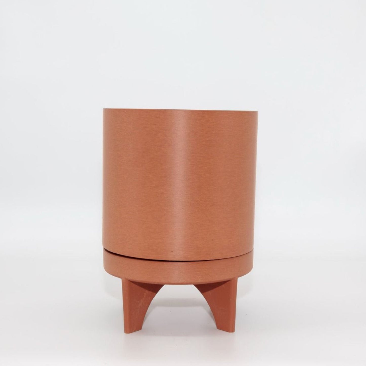 Single Florence recycled plastic plant pot with a smooth minimalist tapered silhouette on a clean white background, available in Australia. Terracotta variant.