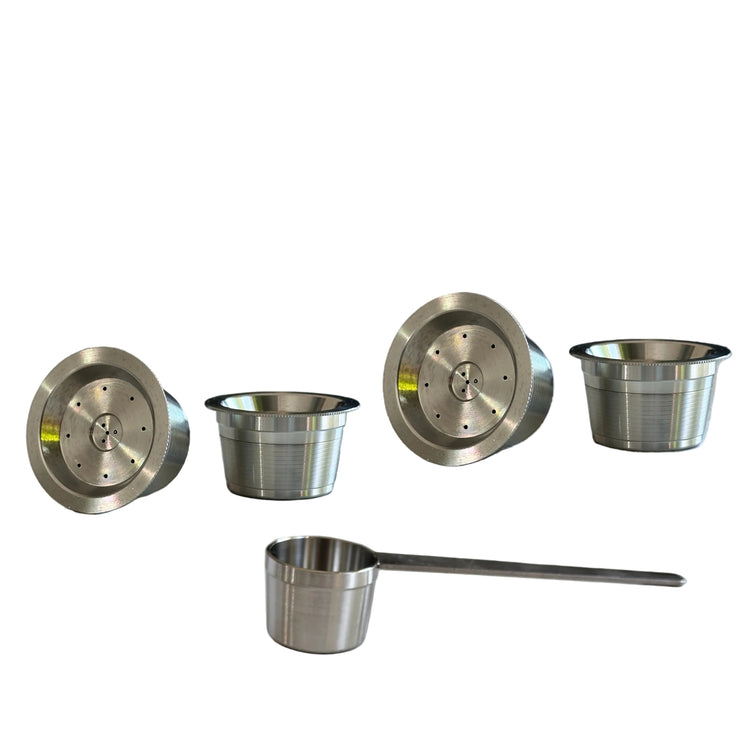 Four single reusable stainless steel coffee capsules compatible with Aldi K-Fee, Caffitaly or Verismo machines with a scoop.