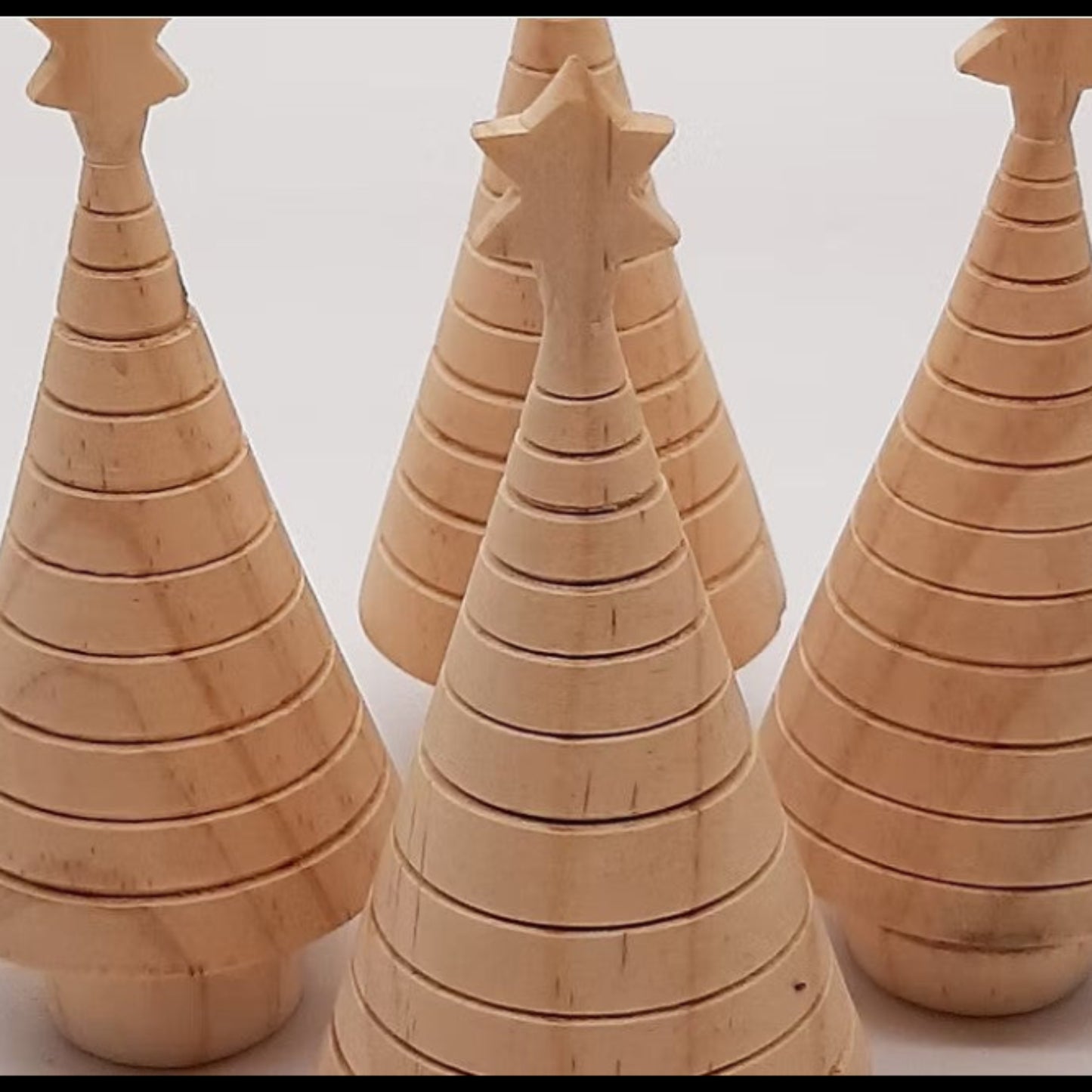 A selection of eco-friendly Christmas tree decorations made from 100% recycled wood.