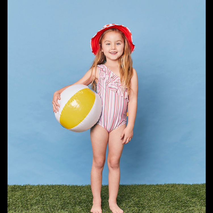 On-model view showcasing the asymmetric fit and shoulder ruffle profile of the girls gelato stripe swimsuit.