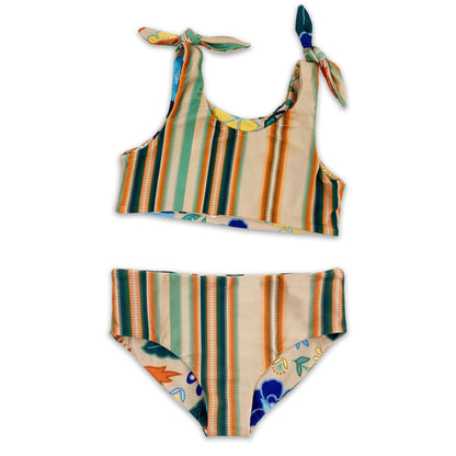 The reverse side of the girls two piece bather set showcasing the vibrant multicolour serape stripe pattern.