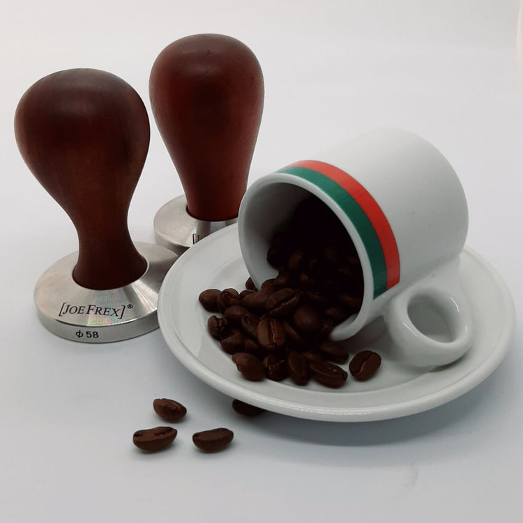 Two premium hand-turned recycled timber coffee tampers with a precision-weighted stainless steel base, handcrafted in Australia by Lyons Woodturning styled with beans and a cup and saucer.