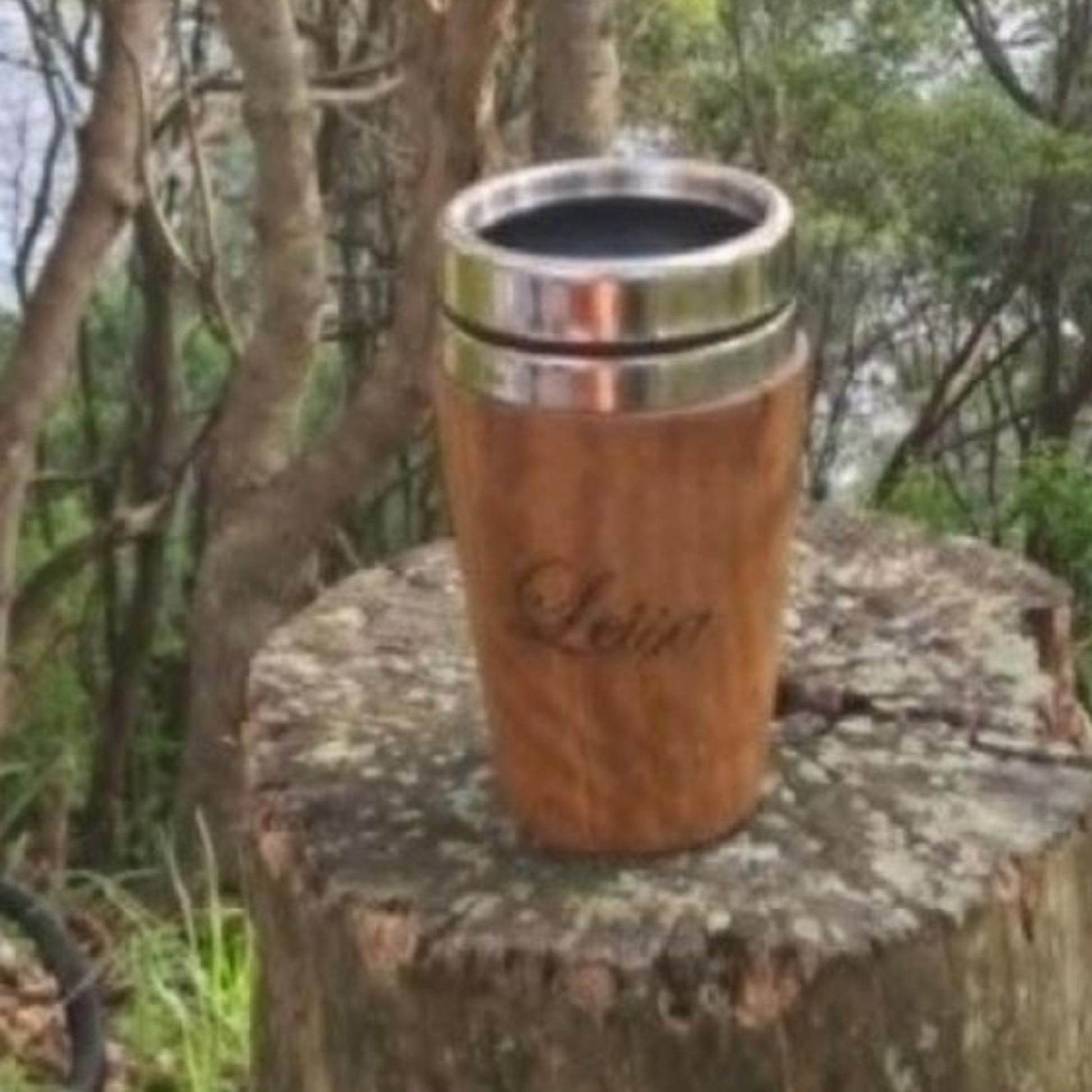 Insulated hand-turned recycled timber coffee travel mug with a stainless steel interior lining, handcrafted in Australia by Lyons Woodturning showing personalised engraving.