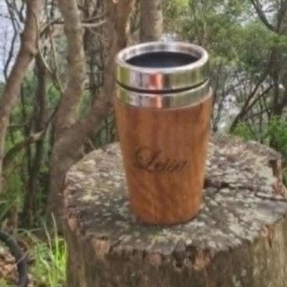 Insulated hand-turned recycled timber coffee travel mug with a stainless steel interior lining, handcrafted in Australia by Lyons Woodturning showing personalised engraving.