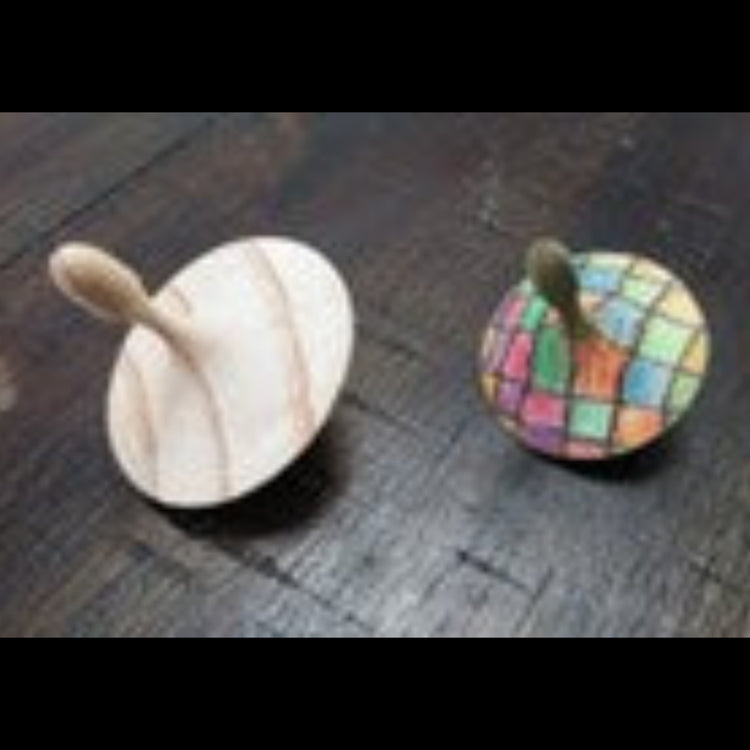 Hand-turned recycled timber spinning top with a light unoiled finish, handcrafted in Australia by Lyons Woodturning one hand coloured.