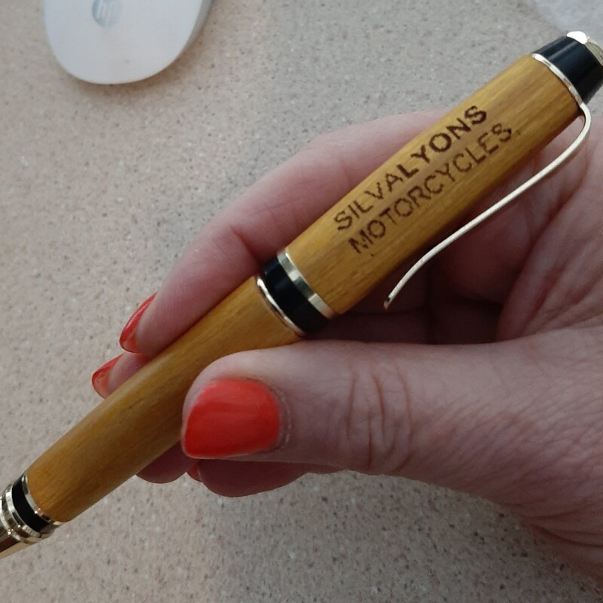 A beautifully hand-turned timber barrel pen crafted from recycled wood by Lyons Woodturning in Australia, compatible with Parker pen refills in use.