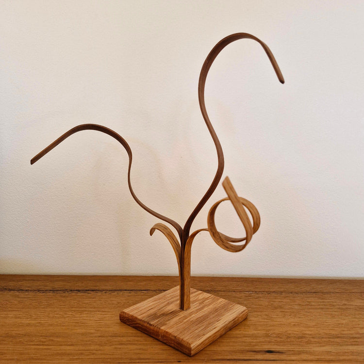 Handcrafted timber sculpture, American Oak and Blackwood art piece on a sideboard.