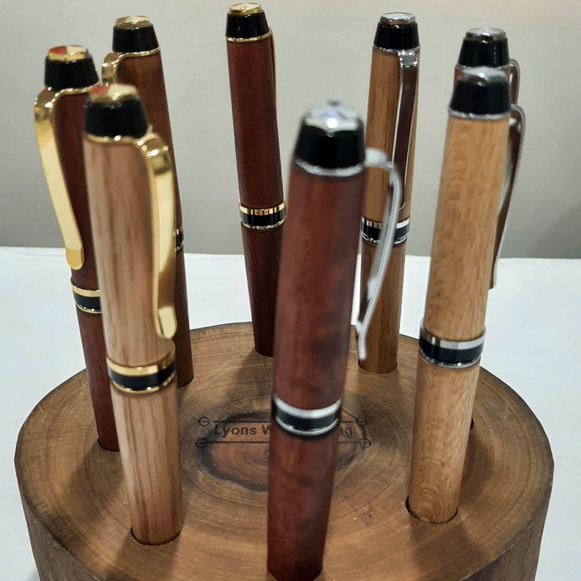 Custom handmade wooden pens showing natural timber grain variations and premium hardware fittings, made locally in Jindera, New South Wales.