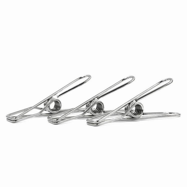 Close-up profile view of a three wire-formed rust-resistant stainless steel clothes peg displaying its ergonomic loop spring mechanics on a white background.