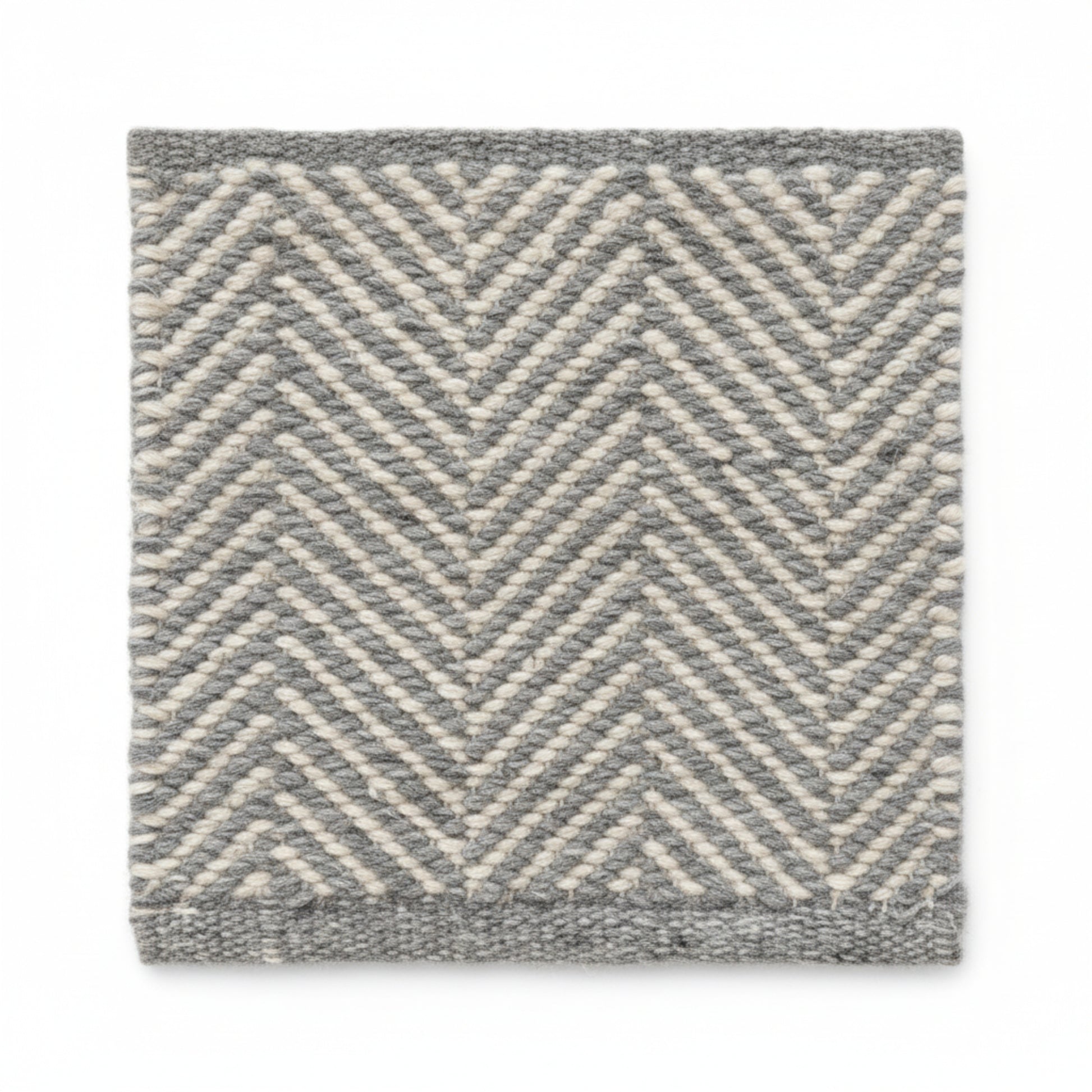 Close-up texture detail of the sustainable herringbone weave pattern on a Henshall grey recycled plastic floor mat.