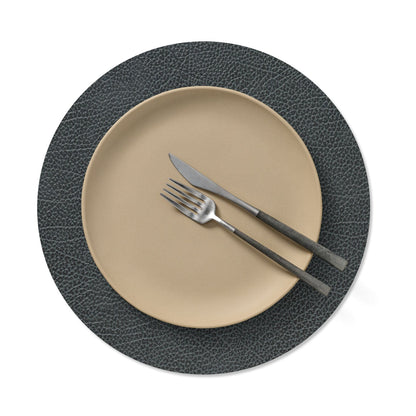 Circle recycled leather placemat featuring the signature LIND DNA Hippo texture with plate setting in black anthracite.