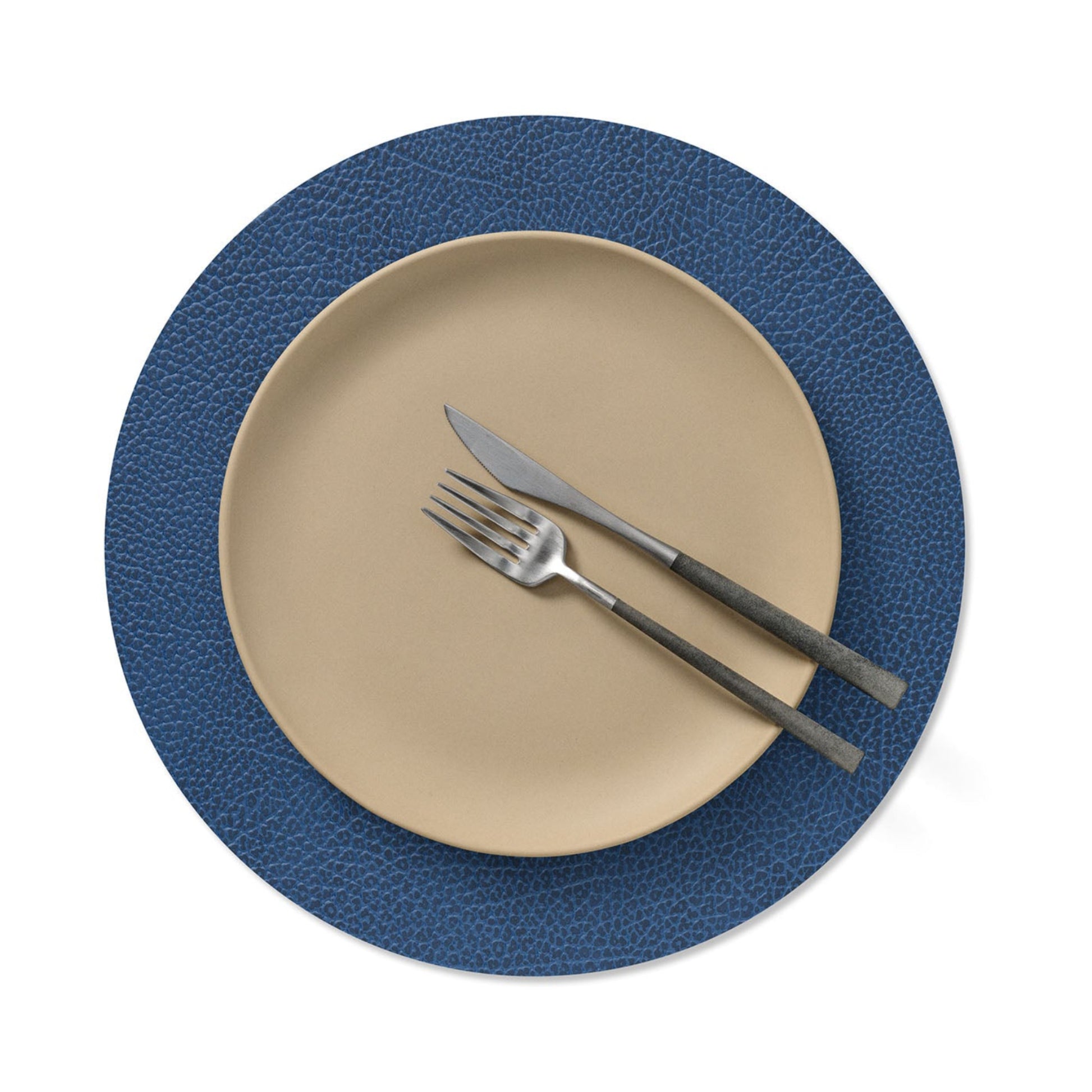 Circle recycled leather placemat featuring the signature LIND DNA Hippo texture with plate setting in navy blue.