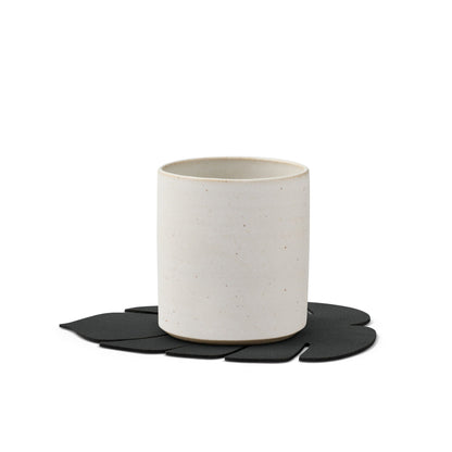 Monstera leaf recycled leather coaster featuring the signature LIND DNA hippo texture with a cup.