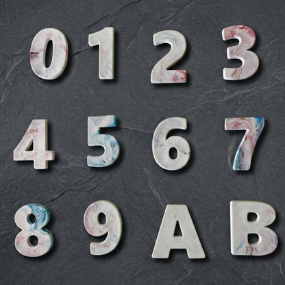 Custom recycled plastic house numbers for letterboxes with marbled texture white palette.