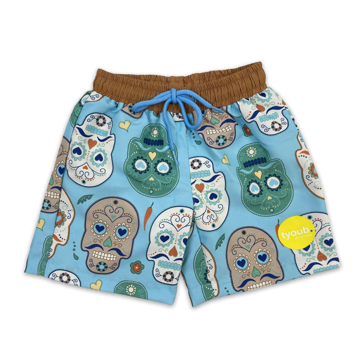 Kids quick dry boardshorts in aqua blue Skulls Amigo day of the dead sugar skull print.