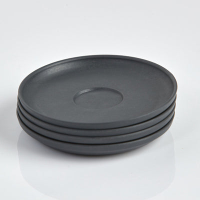 Pack of 4 Huskee small 3oz espresso saucers featuring the signature vertical ribbed design made from sustainable coffee husk waste top view charcoal.
