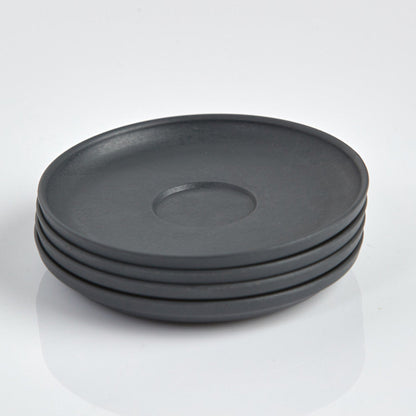 Pack of 4 Huskee small 3oz espresso saucers featuring the signature vertical ribbed design made from sustainable coffee husk waste top view charcoal.